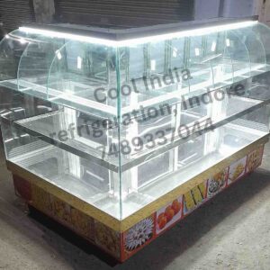 It is ss glass sweet display counter with extra shelves for namkeen or other food items used in hotels, sweet and food shops